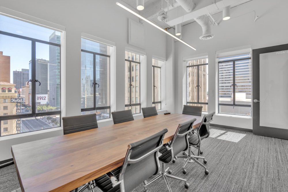 Meeting and event space at the Heard Building Heard Building conference room with a long table, office chairs and large windows